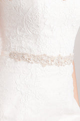 Close up of Laura Jayne Trista leaf gold wedding belt on woman's torso