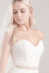 Bride wearing Trista leaf gold wedding dress belt by Laura Jayne Accessories