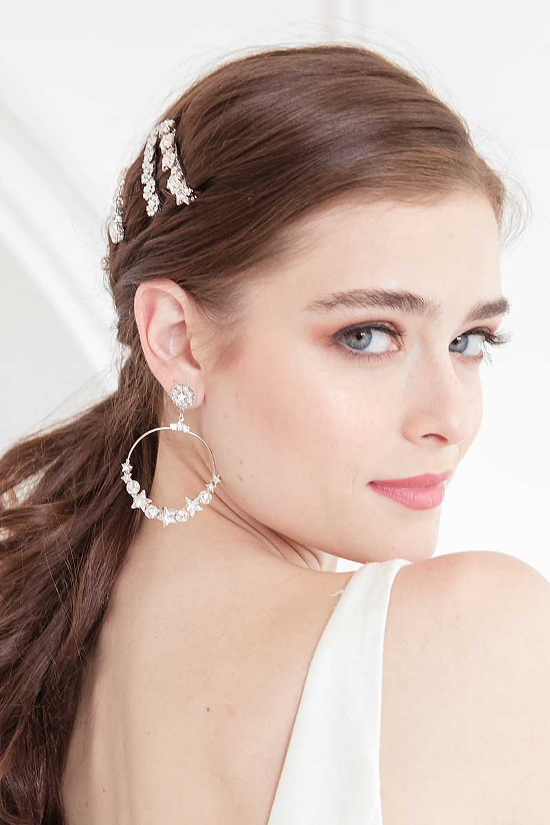 woman with large hoop earrings with crystal stars E0075 from Laura Jayne Bridal