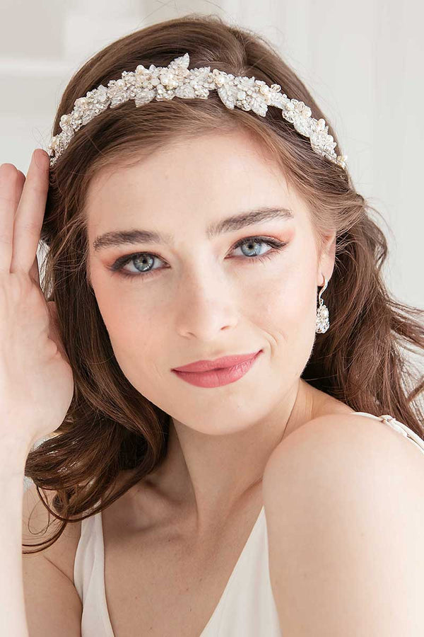 head and shoulders of bride wearing Alexia dimensional embroidered crystal pearl headband by Laura Jayne