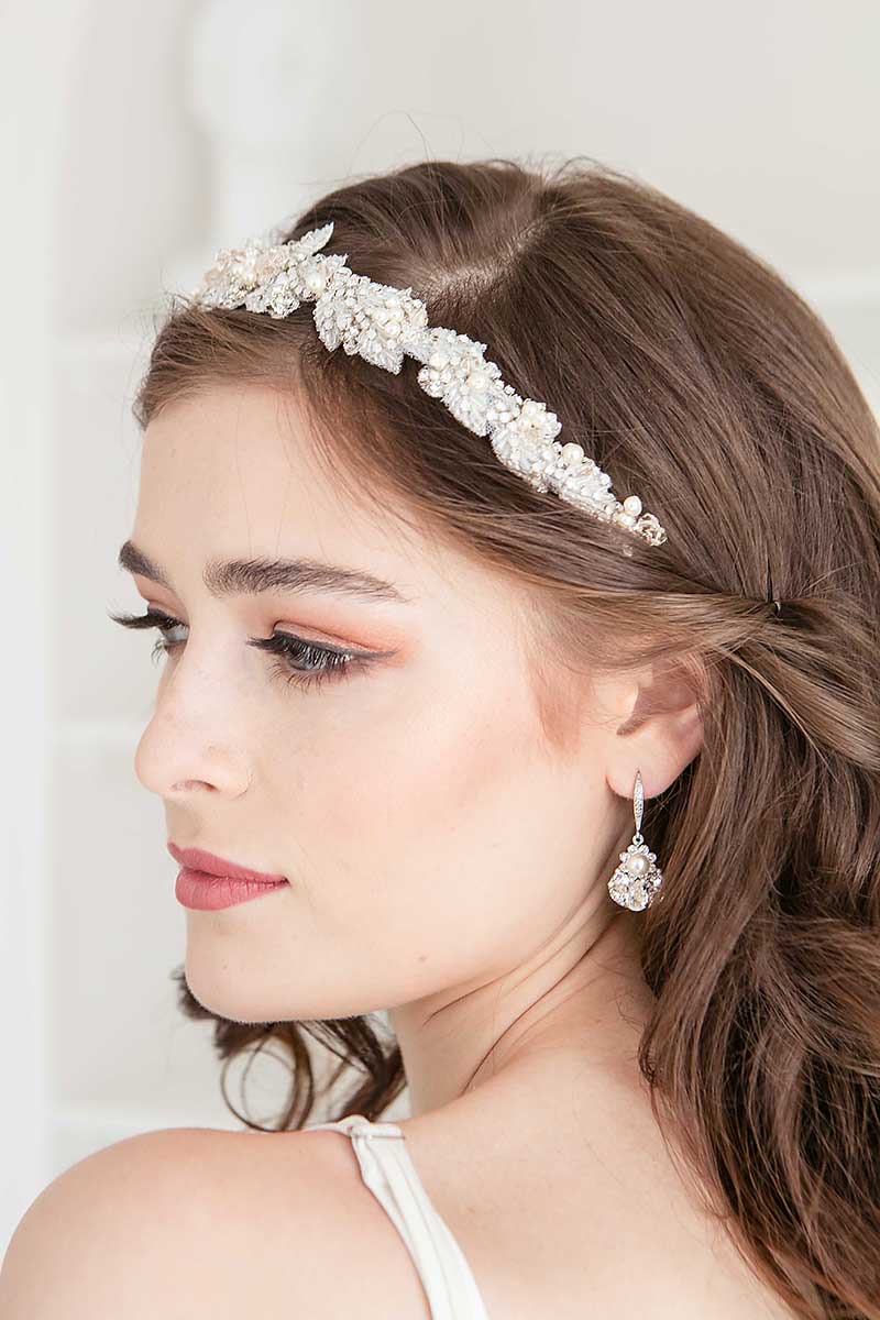 Profile view of bride wearing dimensional beadwork Alexia floral headband by Laura Jayne