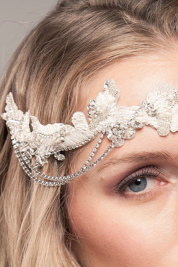 Close up of woman wearing draped chain bridal headpiece by Laura Jayne of Toronto Canada