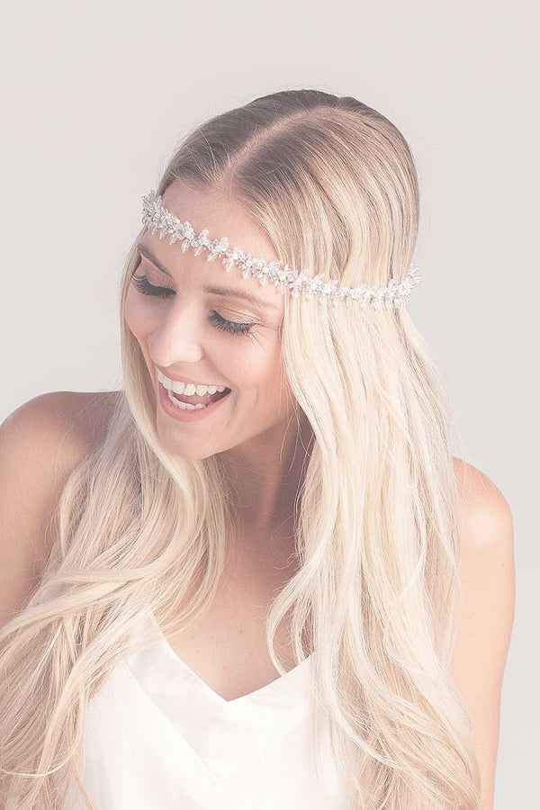 Woman wearing beaded fringe headband across forehead