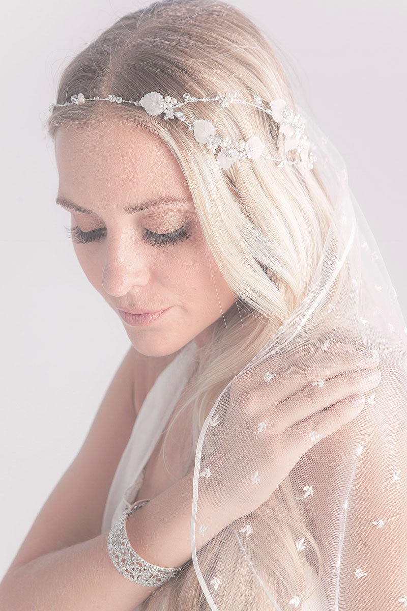 Bride wearing leaf and pearl hairvine Navarre b Laura Jayne Accessories