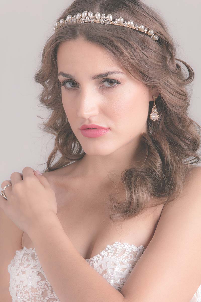 Bride wearing teardrop pearl tiara by Laura Jayne Accessories