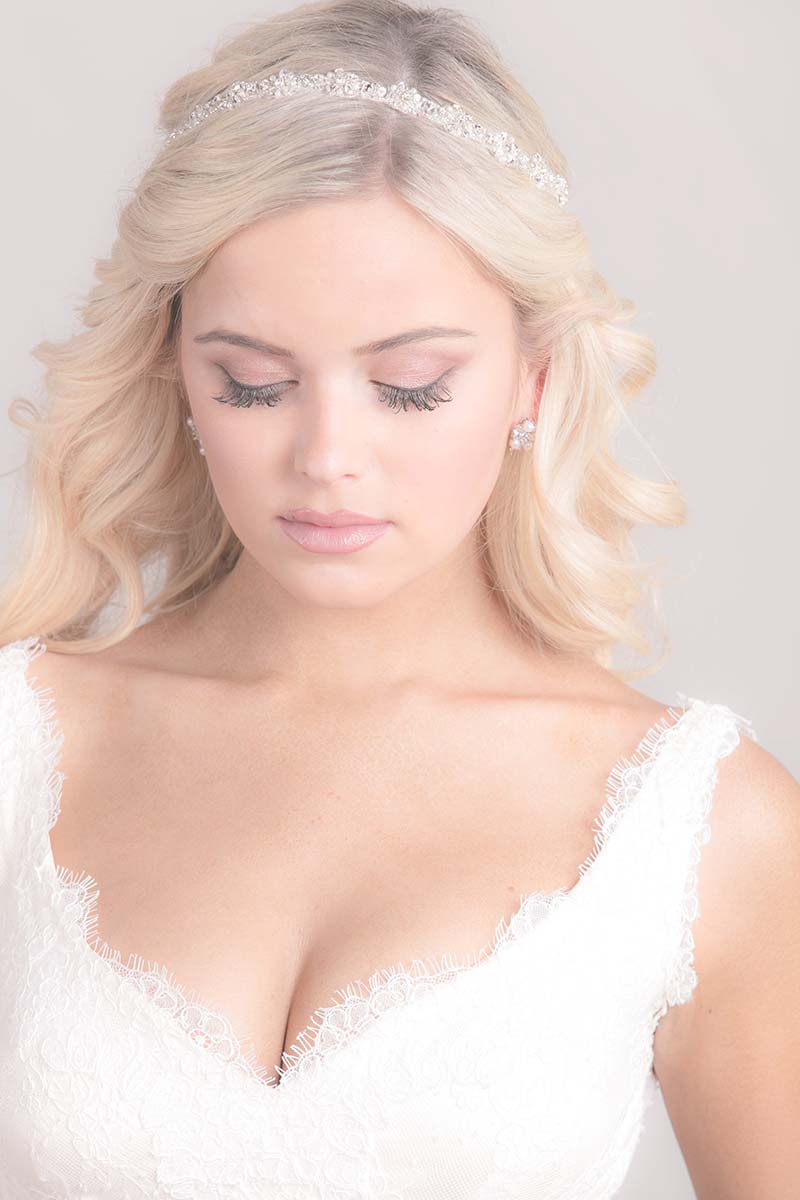 Bride with beachy waves hairstyle wearing Laura Jayne Aurora hair ribbon bridal accessory