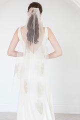 Back view of bride wearing tropical inspired Isla Gold Floral Waltz Wedding Veil  with lush metallic organza blooms. Laura Jayne Accessories Toronto. Handcrafted in Canada.  