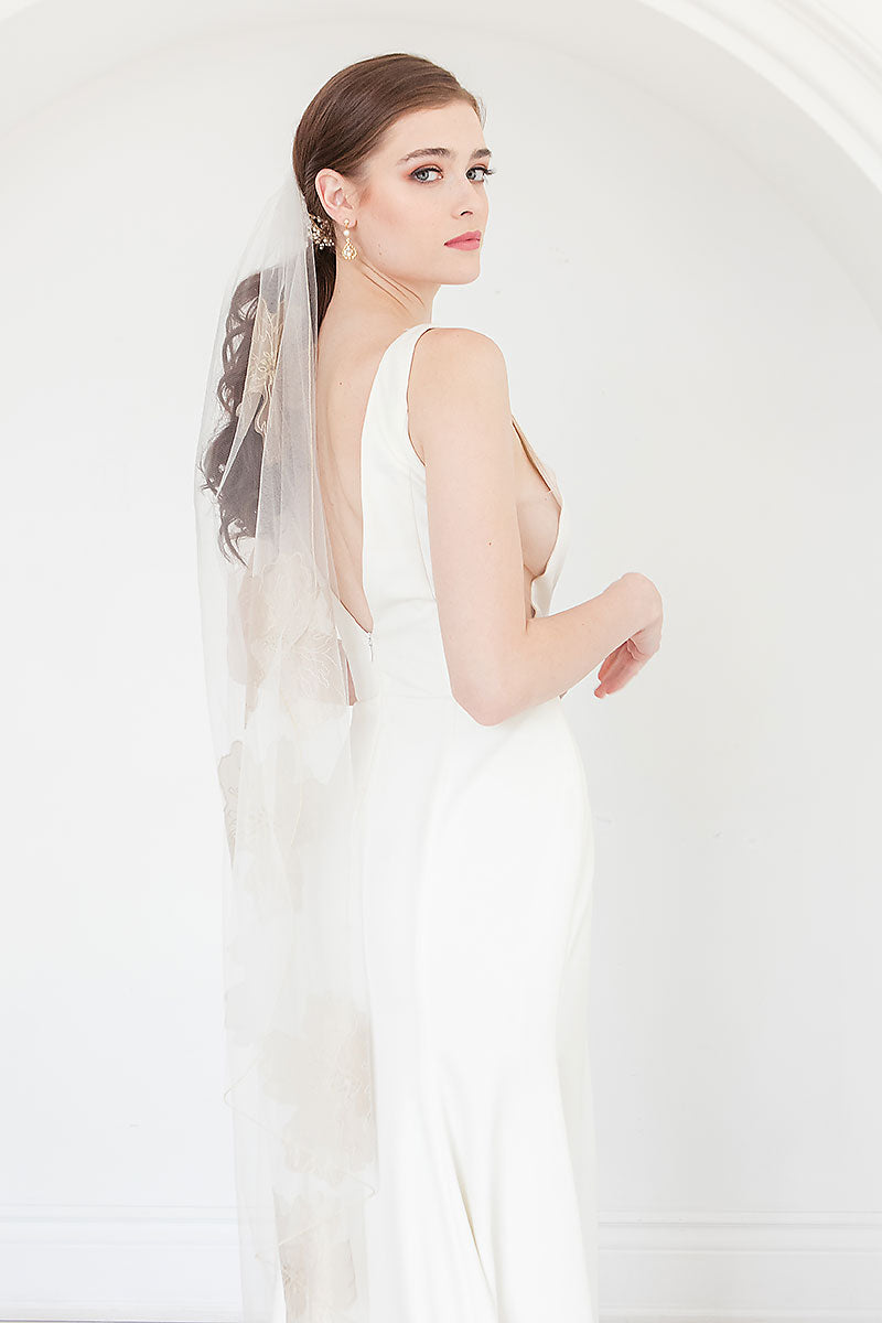 Modern bride wearing a chic ultra sheer waltz length bridal veil with floral embroidery and gold metallic edge. Isla Gold Floral Waltz Wedding Veil from Laura Jayne Accessories Toronto. Handcrafted in Canada.  