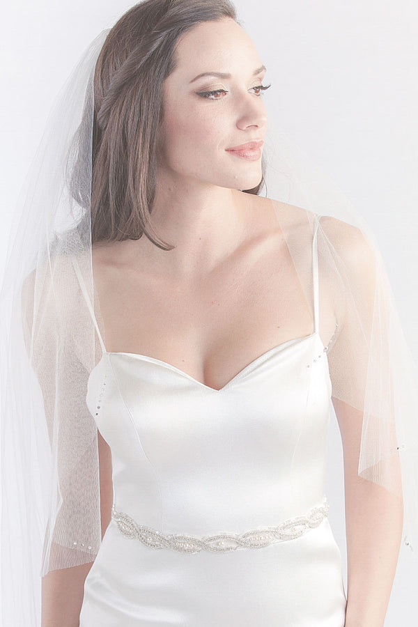 Modern minimalist bride wearing timeless single tier fingertip length veil with crystals. Dana Fingertip Veil by Laura Jayne Accessories Toronto. Handcrafted in Canada.