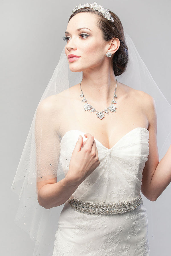 Classic bride wearing a two-tier fingertip length drop veil with crystals. Lucille Crystal Fingertip Drop Veil by Laura Jayne Accessories Toronto. Handcrafted in Canada.