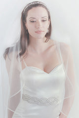 Bride wearing Taylor horsehair fingertip veil by Laura Jayne Accessories Toronto. Handcrafted in Canada.