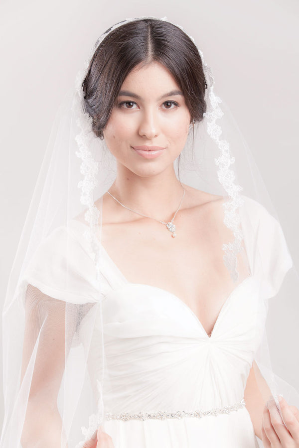 Modern bride wearing romantic boho inspired fingertip length Juliet veil with a delicate French lace floral edge. Alyssia Lace Juliet Veil by Laura Jayne Accessories Toronto. Handcrafted in Canada.