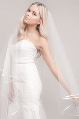 Profile view of Miranda ribbon edge cathedral veil by Laura Jayne Accessories Toronto. Handmade in Canada.