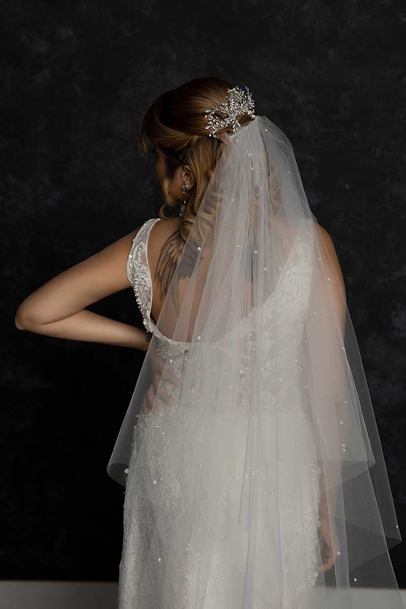 back view of bride from waist up wearing pearl beaded cathedral veil Alayna by Laura Jayne Accessories
