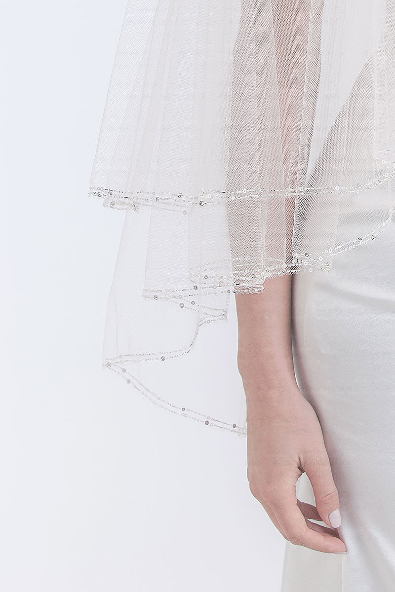 edge of beaded veil with woman's arm